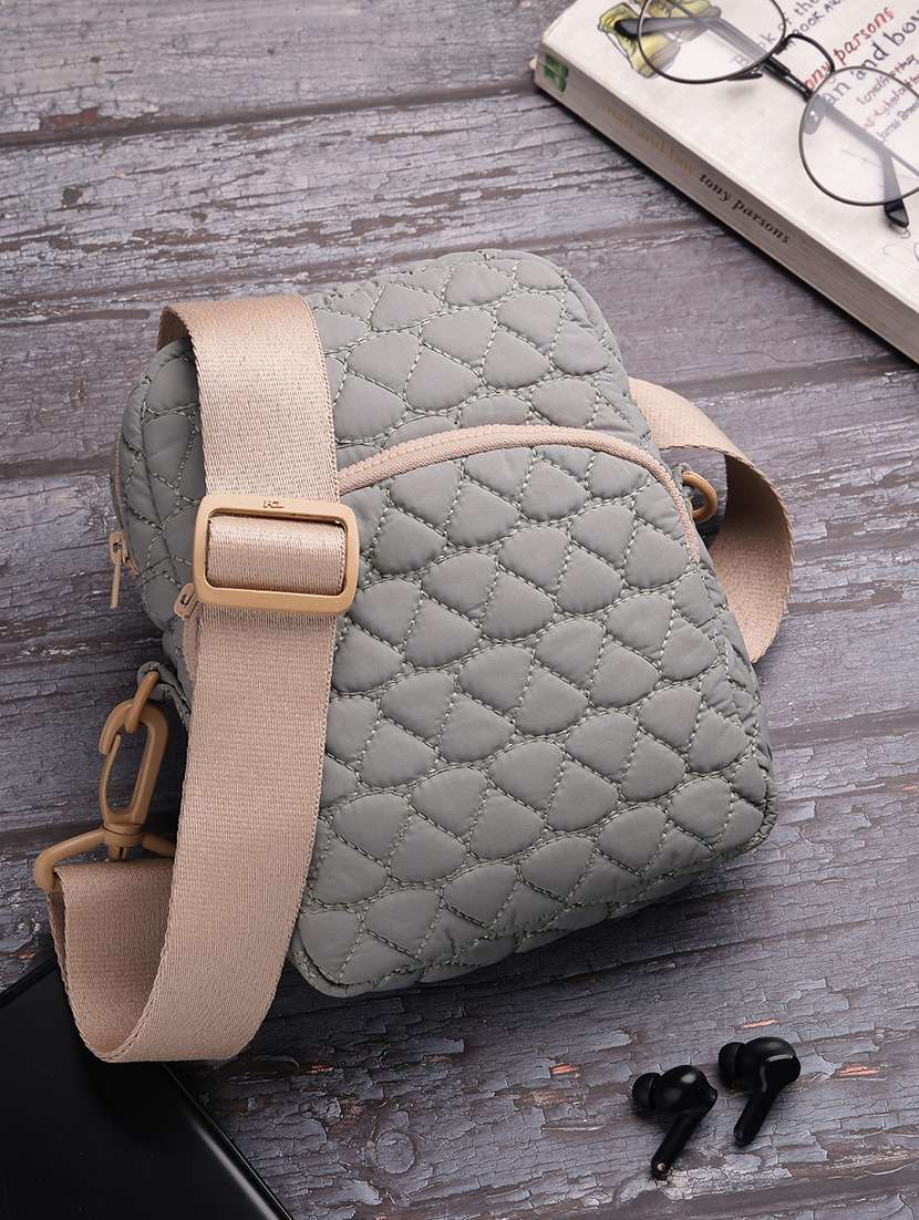 women textured sling bag with adjustable strap