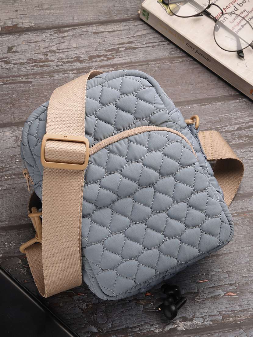 women textured sling bag with adjustable strap